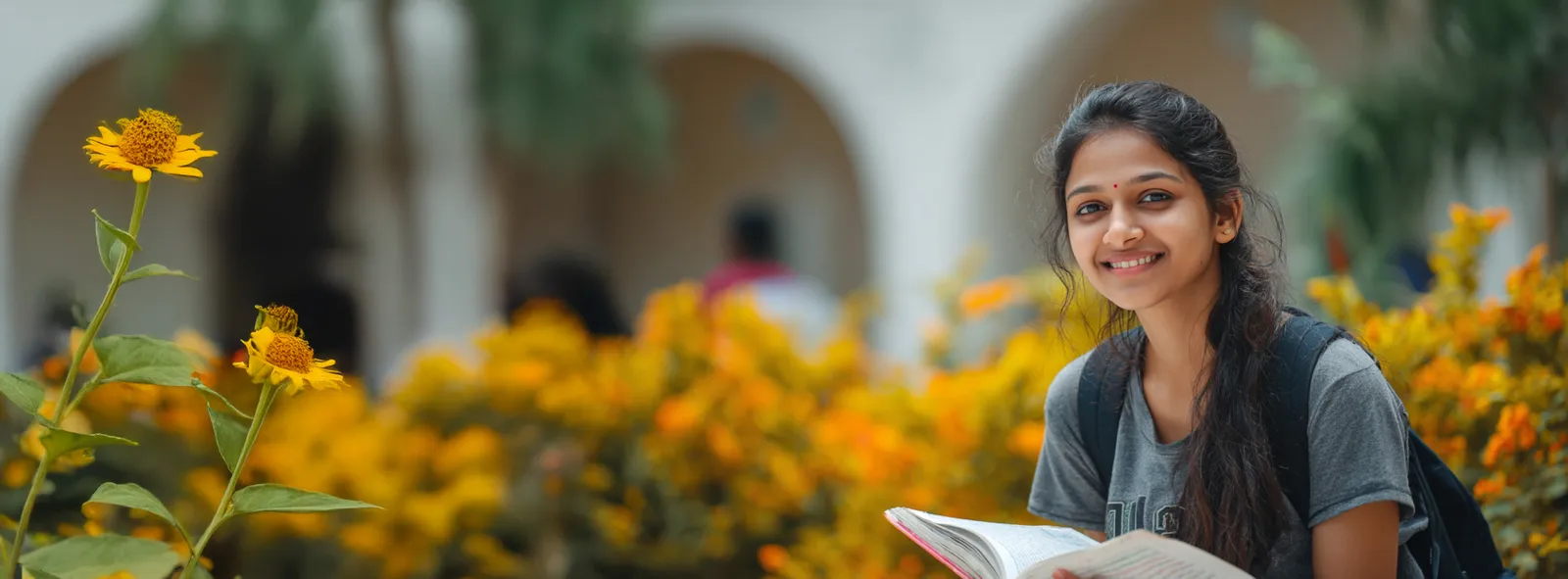 A Mahalakshmi College for Girls student reading in the campus garden